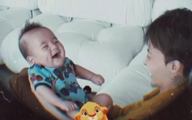 G-Dragon lifts his nephew high in the air