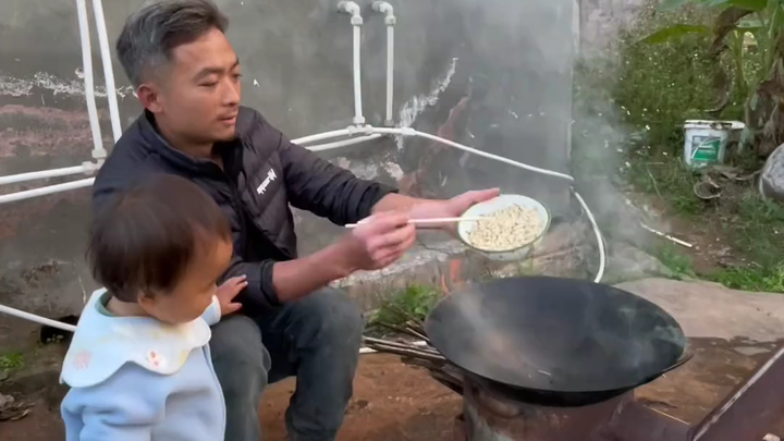 Frying bamboo worms—my daughter’s favorite dish today!