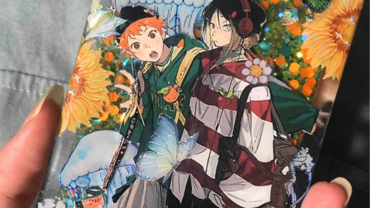 Hinata and the cat standing on the sand