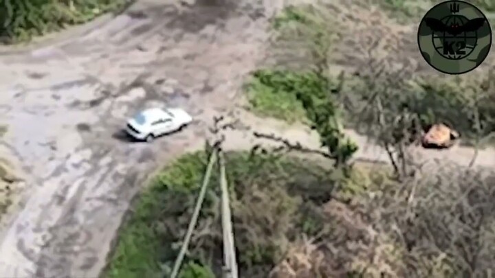 Drone footage of a Russian vehicle carrying troops struck by a projectile. #ukraine #russia