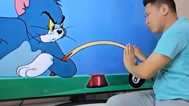 A foreign guy is playing pool with Tom right through the screen!