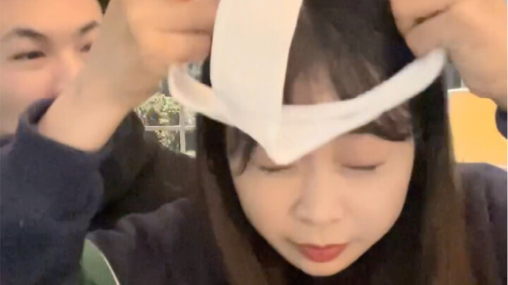 While filming a video with her boyfriend, she pretended to pull out a condom and put it on her head…