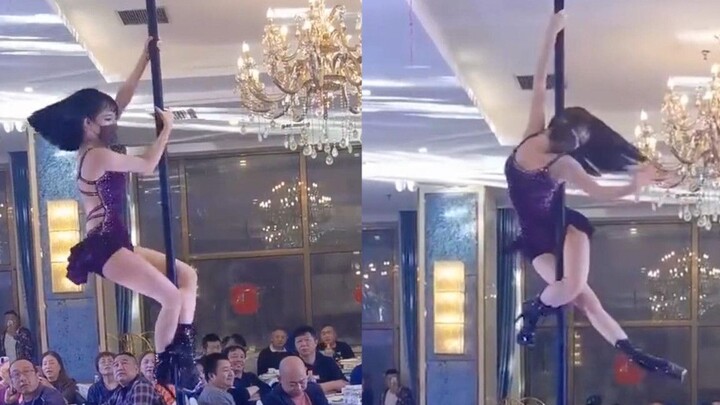 A woman performed a pole dance at a wedding, her figure was hot and her dance moves were enchanting,