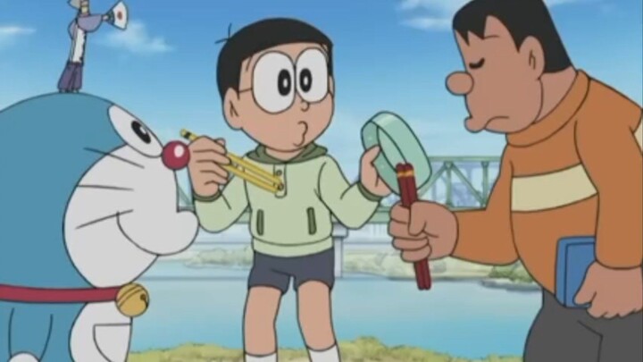 nobita sedang membantu giant