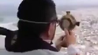 Spanish Catholic priest uses Saint Death light to purify COVID-19 from a helicopter, even bringing a