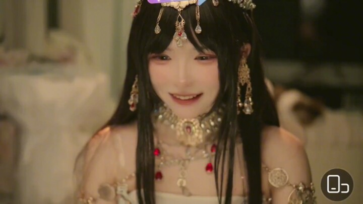 What does Teacher Tuniang do to Axi while wearing Xinjiang clothing?