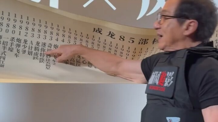 A movie fan presented Jackie Chan with a scroll showcasing his films over the years, and immediately