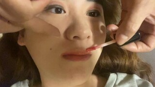 My mother put makeup on me