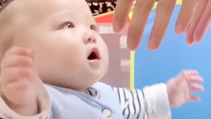 When baby starts sweetly and softly asking to be held, who could possibly resist?