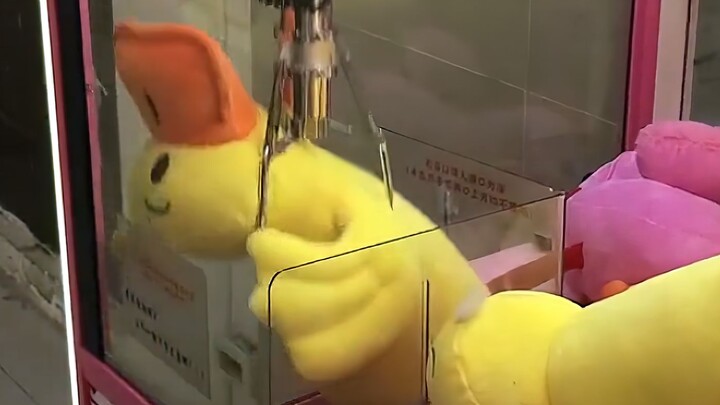 “A Collection of Claw Machines Teasing Humans”