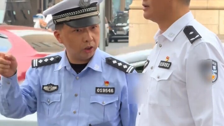 When you compliment her looks, she remains deadpan; when you mention her police rank, the corner of 