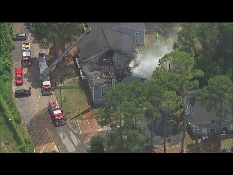 Fire crews work to put out apartment fire in DeKalb County