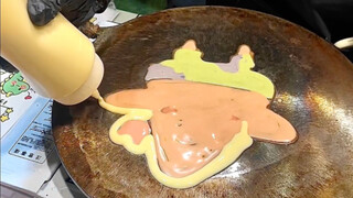 The pancakes are rolled up too! The art teacher set up a stall to sell pancakes, and drew various ca