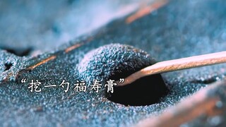 The man is smoking *, while his sister is about to enjoy crocodile cuisine at the wedding banque