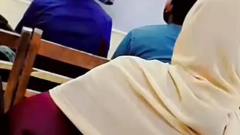 A teacher in a Pakistani school teacher his students