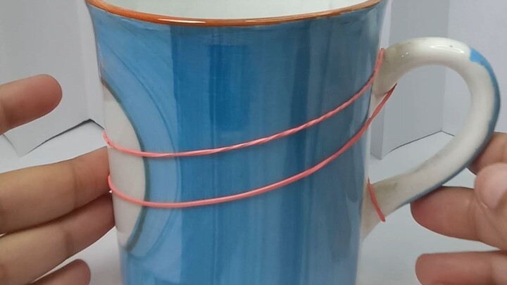 How is this even possible?! 🤯🥤 One cup. One rubber band.