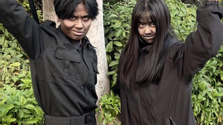 Standing with my dark-faced junior female schoolmate