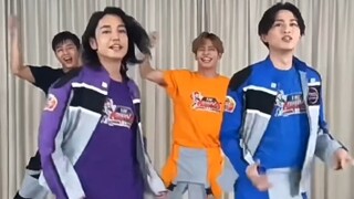 The two people in front who are jumping the full jump and the two people in the back who are jumping
