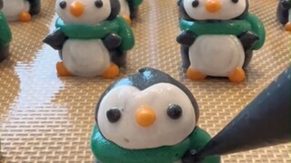 The sweet shop lady effortlessly makes all sorts of creatively shaped meringue cookies—her hands don