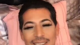 The young lady cleaned her dad's face and "accidentally" put heavy makeup on him...