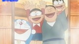 Nobita's family soaked in the hot spring together, enjoying the panoramic view and enjoying it