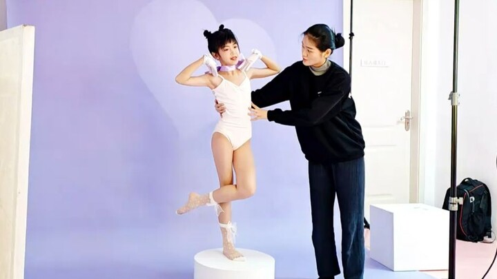 Landscape-mode behind-the-scenes video of a dance studio shooting dance portraits of its students, w