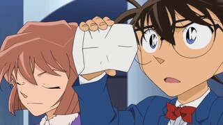 Conan asked the doctor for New Year's money and complained that it was too little. Ai's expression w