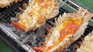 Thai cuisine: Grilled giant prawns and black tiger prawns, arm-sized freshwater shrimp with cheese a