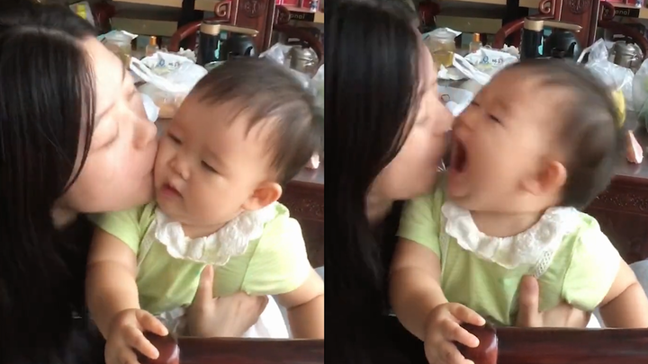 Auntie turns into "baby sucking" mode when she sees her niece. The baby is annoyed by the kiss, and 