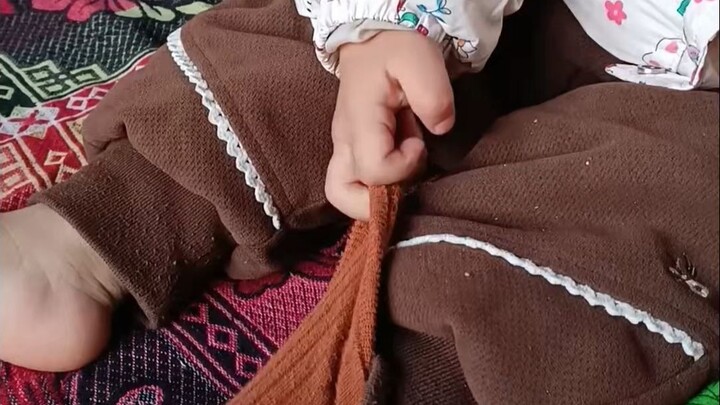 A creative method for putting socks on a baby: I thought the first one was just a coincidence! It wa