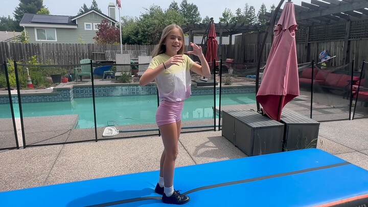 American girl practicing cheerleading dance