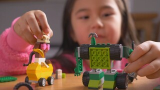 Little girl playing with lego