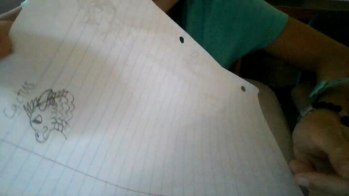 Mayleigh drawing a dragon.