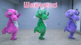 A cover dance of "Weekend" in crocodile costume