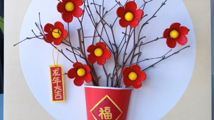 Don’t throw away those egg cartons—use them with some dry twigs to create a beautiful three-dimensio