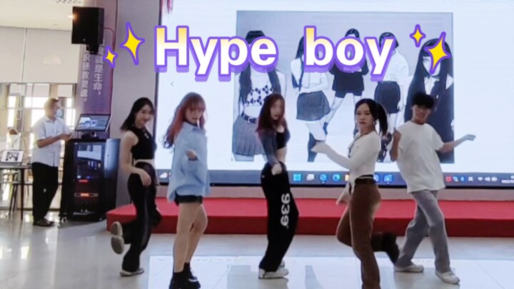 Huge hype boy dance in the cafeteria center