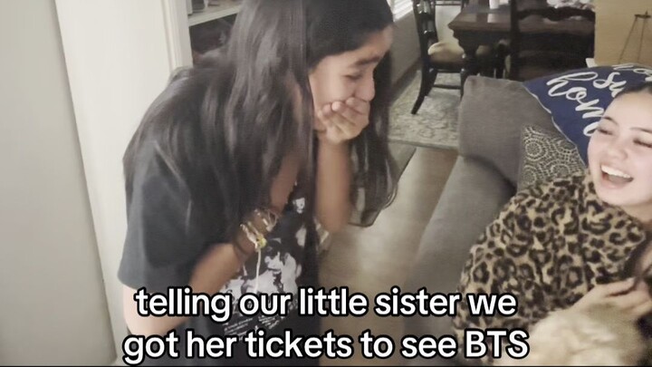 telling our little sister we got her tickets to see BTS