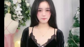 Lips slightly pursed, eyes brimming with allure.