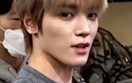 Taeyong has a cell phone hanging on his waist. He ranks first in steps tonight.