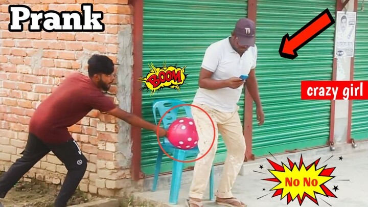 Popping ballon blast prank on public seat