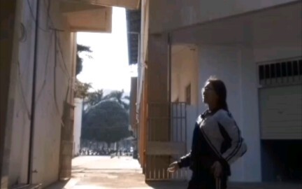 How do the light and shadow in the scene metaphorically reflect the characters’ psychological change