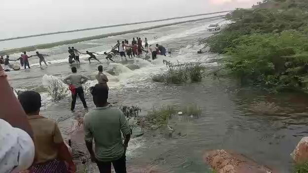 indians are saving bike in dangerous water falls