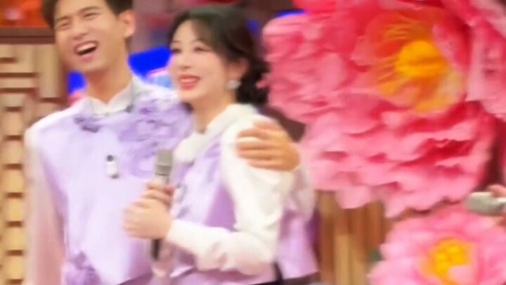 Everyone was playing games in front, and he was hugging her from behind.