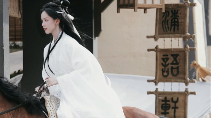 Holy crap! All that horse-riding training paid off! This scene of the guy in white riding a horse to