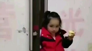 The daughter is happily eating an apple when her dad asks, "What score did you get on the test?"