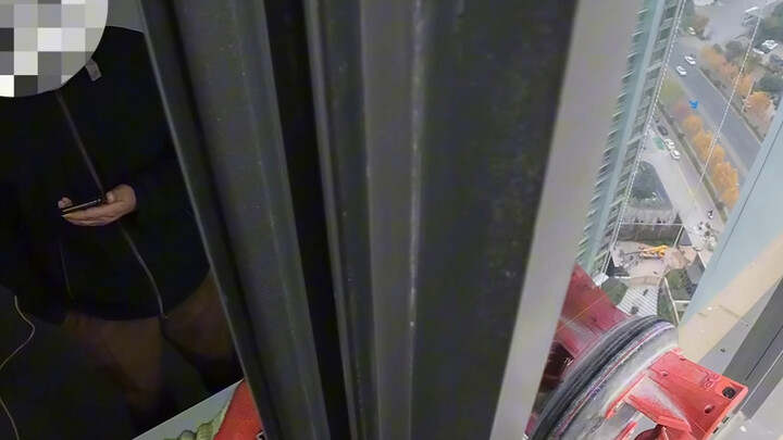 First-person view of Spider-Man doing high-altitude work.