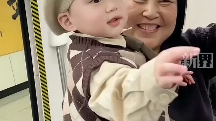 Social butterfly baby greets strangers by touching their face.