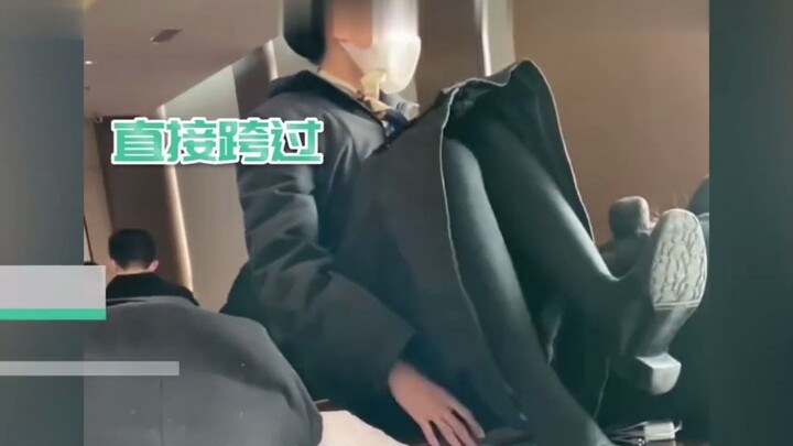 Tsinghua University students take a nap on their desks during class breaks—when a girl sits right on