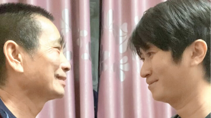 Challenging my dad to catch paper with our faces