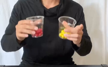 A sleight-of-hand magic trick that initially looks indistinguishable, but can be clearly explained a